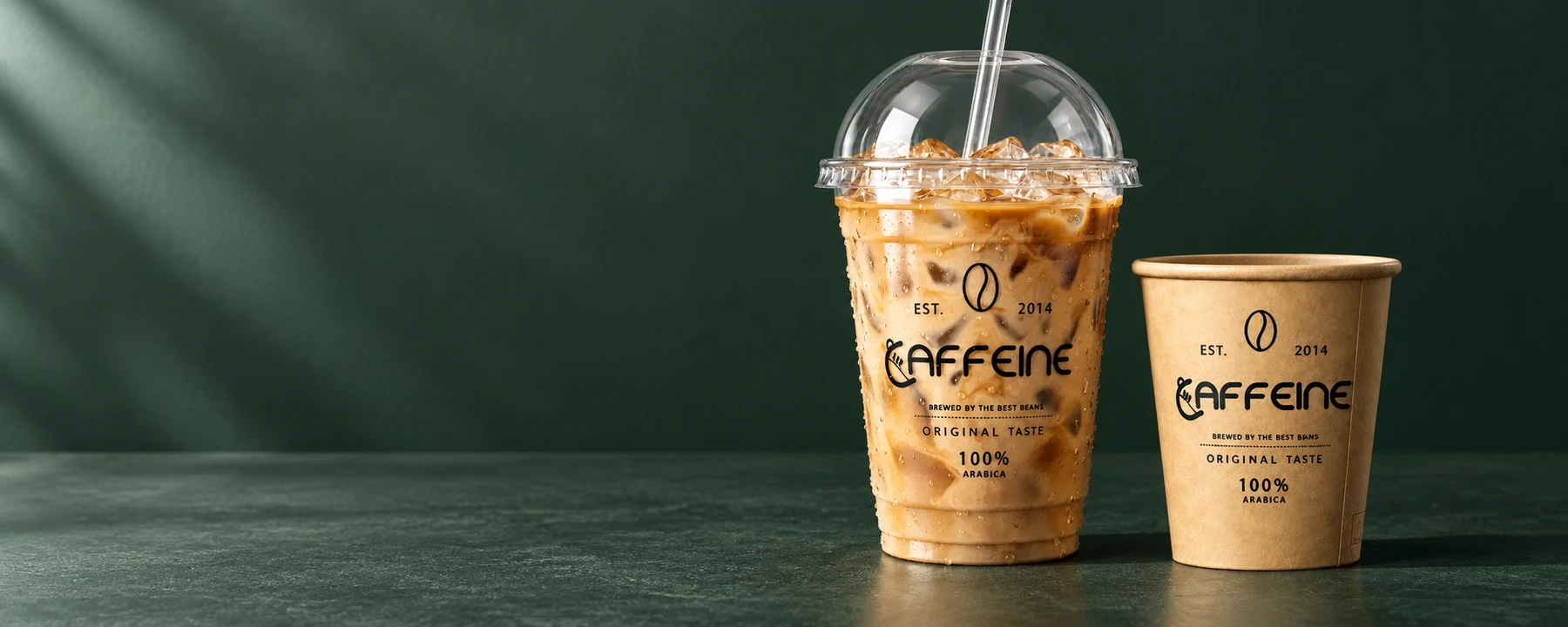 Caffeine iced latte and espresso cups on a green coffee counter